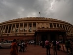 Rain clouds cover the skyline above the Parliament House complex in New Delhi,