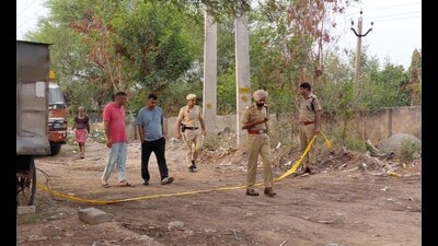 Police at the crime scene near the Sector 19 underpass in Panchkula. (Sant Arora/HT)