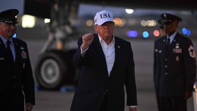 US President Donald Trump gestures toward reporters after disembarking from Air Force One at Joint Base Andrews, Maryland on July 1, 2026. (AFP)
