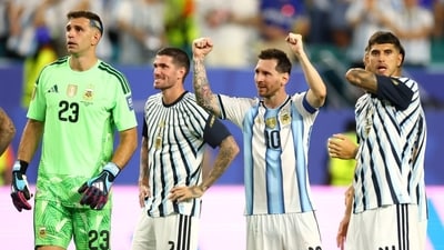 Emiliano Martinez (No. 23), Rodrigo De Paul (No. 7), Lionel Messi (No. 10) and Exequiel Palacios (No. 14) celebrate after Argentina’s win.