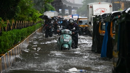 Mumbaikars brave flooded streets, homes as rain disrupts normal life | PICS