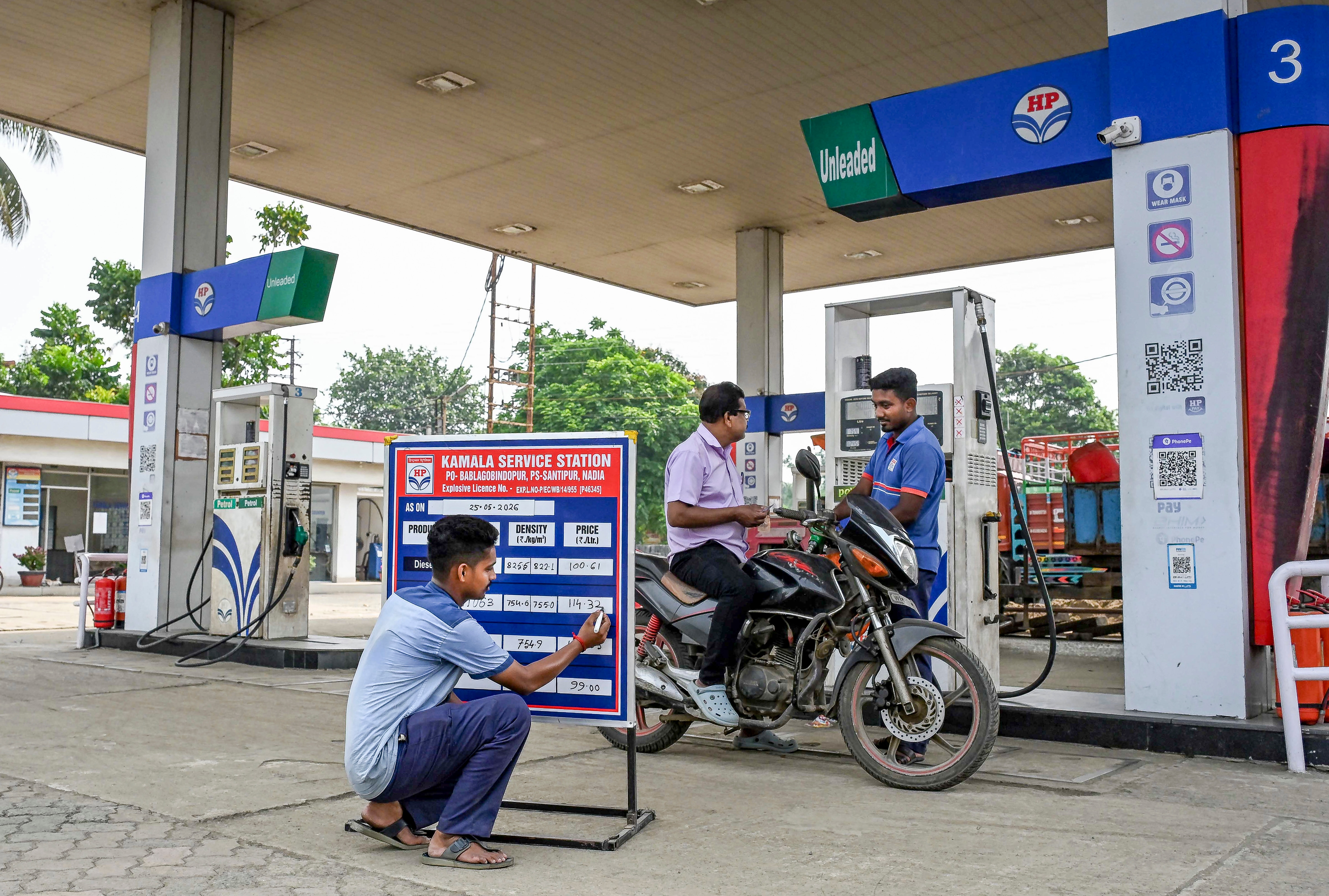 A worker updates prices at a petrol pump in Nadia, West Bengal. (PTI File Photo) A worker updates prices at a petrol pump in Nadia, West Bengal. (PTI File Photo)