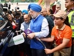 Union minister for petroleum and natural gas Hardeep Singh Puri fills ethanol-blended fuel in a car during the launch of 'E85', a blend of 85% ethanol and 15% petrol, at an Indian Oil fuel station in New Delhi in June. For now, the debate is raging over E20 even as E85 and flex fuel are being touted by the Modi government.