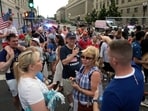 Visitors evacuate the National Mall in Washington, DC, as severe storms threaten July 4th celebrations..