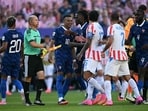 France's forward #10 Kylian Mbappe argues with Paraguay's defender #02 Gustavo Velazquez and defender #15 Gustavo Gomez during the 2026 World Cup round of 16 match