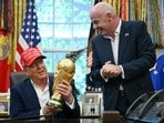 Gianni Infantino and Trump with the FIFA World Cup Trophy at the Oval Office.
