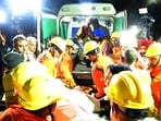 NDRF teams rushing the victims to the hospital after the building collapse at Industrial Area, Phase 2, Chandigarh; and (below) rescue teams at the site earlier in the evening. (Ravi Kumar/HT)