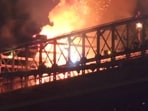 In this image taken from video, a fire breaks out on the Brooklyn Bridge in New York during the city's fireworks celebration on Saturday, July 4, 2026. (AP Photo/Aron Ranen)