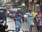 Pedestrians make their way through the rain in Amritsar. The IMD has predicted heavy rain, thunderstorms and gusty winds up to 50 km per hour at isolated places till July 8. (Sameer Sehgal/HT)