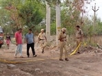 Police at the crime scene near the Sector 19 underpass in Panchkula. (Sant Arora/HT)
