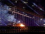 A fire burns on the Brooklyn Bridge after the Macy's Fourth of July Fireworks celebration in New York, on July 4, 2026. (Photo by Leonardo MUNOZ / AFP)