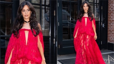 Camila Cabello turned heads in a red Zimmermann Spring 2026 lace gown featuring an off-the-shoulder neckline, sheer skirt and dramatic cape sleeves, finished with a black velvet cross choker. (Instagram)