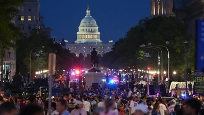 People crowd Pennsylvania Avenue after they were evacuated from the National Mall ahead of severe weather at an Independence Day event and fireworks honoring the nation's 250th anniversary, Saturday, July 4, 2026, in Washington. (AP Photo/Julia Demaree Nikhinson) (AP Photo/Julia Demaree Nikhinson) People crowd Pennsylvania Avenue after they were evacuated from the National Mall ahead of severe weather at an Independence Day event and fireworks honoring the nation's 250th anniversary, Saturday, July 4, 2026, in Washington. (AP Photo/Julia Demaree Nikhinson) (AP Photo/Julia Demaree Nikhinson)
