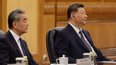 Chinese President Xi Jinping, right, and Foreign Minister Wang Yi attend a meeting with Bangladesh's Prime Minister Tarique Rahman at the Great Hall of the People, in Beijing, China Friday, June 26, 2026. (TINGSHU WANG/Pool Reuters via AP)
