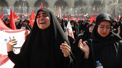 Mourners grieve as they gather to pray for Iran's slain supreme leader Ayatollah Ali Khamenei during the second day of funeral ceremonies at the Grand Mosalla in Tehran. (AFP)