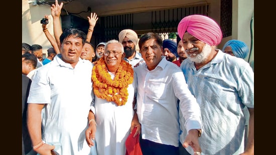 AAP’s Hoshiarpur MLA Brahm Shankar Jimpa (second from right) celebrating his brother Rajeshwar Dyal Babbi’s victory in the Hoshiarpur municipal corporation elections on Sunday. (HT)