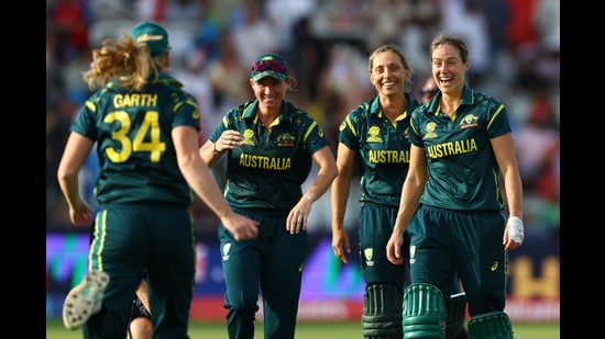 Australia players celebrate after beating England in the ICC Women's T20 World Cup at Lord’s on Sunday. (Reuters)