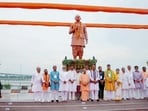 Chief minister Yogi Adityanath in a group photo as he unveils the statues of Bharatiya Jana Sangh founder Shyama Prasad Mukherjee, former PM Atal Bihari Vajpayee and former VHP international president Ashok Singhal during the inauguration of Prerna Park at Kali Ghat, in Prayagraj on Monday. Deputy CM Keshav Prasad Maurya also present. (@myogiadityanath X/ANI Photo))