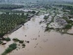 Flooded rivers submerge roads following heavy rains in Gujarat on Sunday. (PTI)