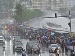 During the high tide, Mumbai police personnel restricted commuters from entering the promenade of Marine Drives in Mumbai, India.