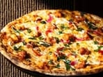 Inside JP Nagara Social: from decadent wood-fired pizza loaded with rich paneer ghee roast to soaring three-story ceilings decorated with a cascading canopy of beautiful cane lamps. (Pics: JP Nagara Social and Sanya Panwar)