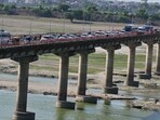 Long queue of vehicles on the Phaphamau bridge on Saturday evening in Prayagraj (Anil Kumar Maurya/HT)
