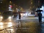 Commuters move through a waterlogged portion of SV Road amid heavy monsoon rains, at Andheri West area, in Mumbai, Maharashtra. Commuters move through a waterlogged portion of SV Road amid heavy monsoon rains, at Andheri West area, in Mumbai, Maharashtra.