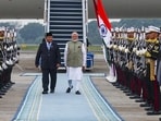 Prime Minister Narendra Modi being welcomed by Indonesia's President Prabowo Subianto on his arrival in Jakarta. (@MEAIndia via PTI Photo)