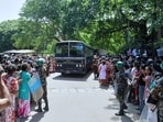 A crowd of people wait outside a prison where deadly clashes broke out on Sunday, in Negombo, 35 kilometers (22 miles) north of the capital Colombo, Sri Lanka.