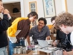 Leïa Ryan, Osama Radi, Hector Miranda Plaza, Nicolas Gertler and Oliver Hime conferring at the Yale Hacker House in San Francisco.