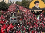 The banners carry the Arabic words "Ya Litharat al Hussein" ("O avengers of Hussein"), a phrase deeply connected to Shia tradition.