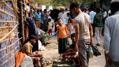 At least eight Rohingya Muslims were killed in landslides as heavy monsoon rains engulf Bangladesh (Reuters)