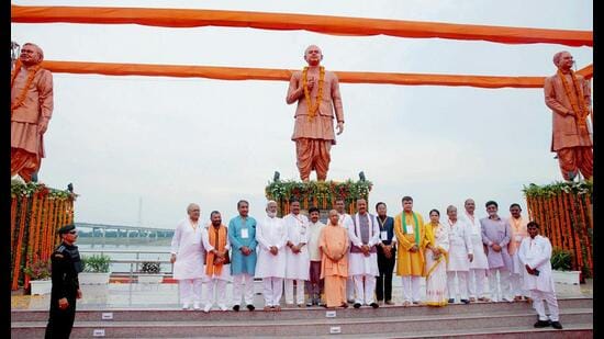 Chief minister Yogi Adityanath in a group photo as he unveils the statues of Bharatiya Jana Sangh founder Shyama Prasad Mukherjee, former PM Atal Bihari Vajpayee and former VHP international president Ashok Singhal during the inauguration of Prerna Park at Kali Ghat, in Prayagraj on Monday. Deputy CM Keshav Prasad Maurya also present. (@myogiadityanath X/ANI Photo))