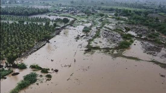 Flooded rivers submerge roads following heavy rains in Gujarat on Sunday. (PTI)