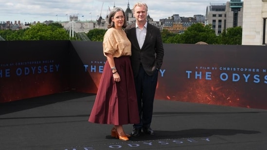 Producer Emma Thomas, left, and director Christopher Nolan pose for photographers