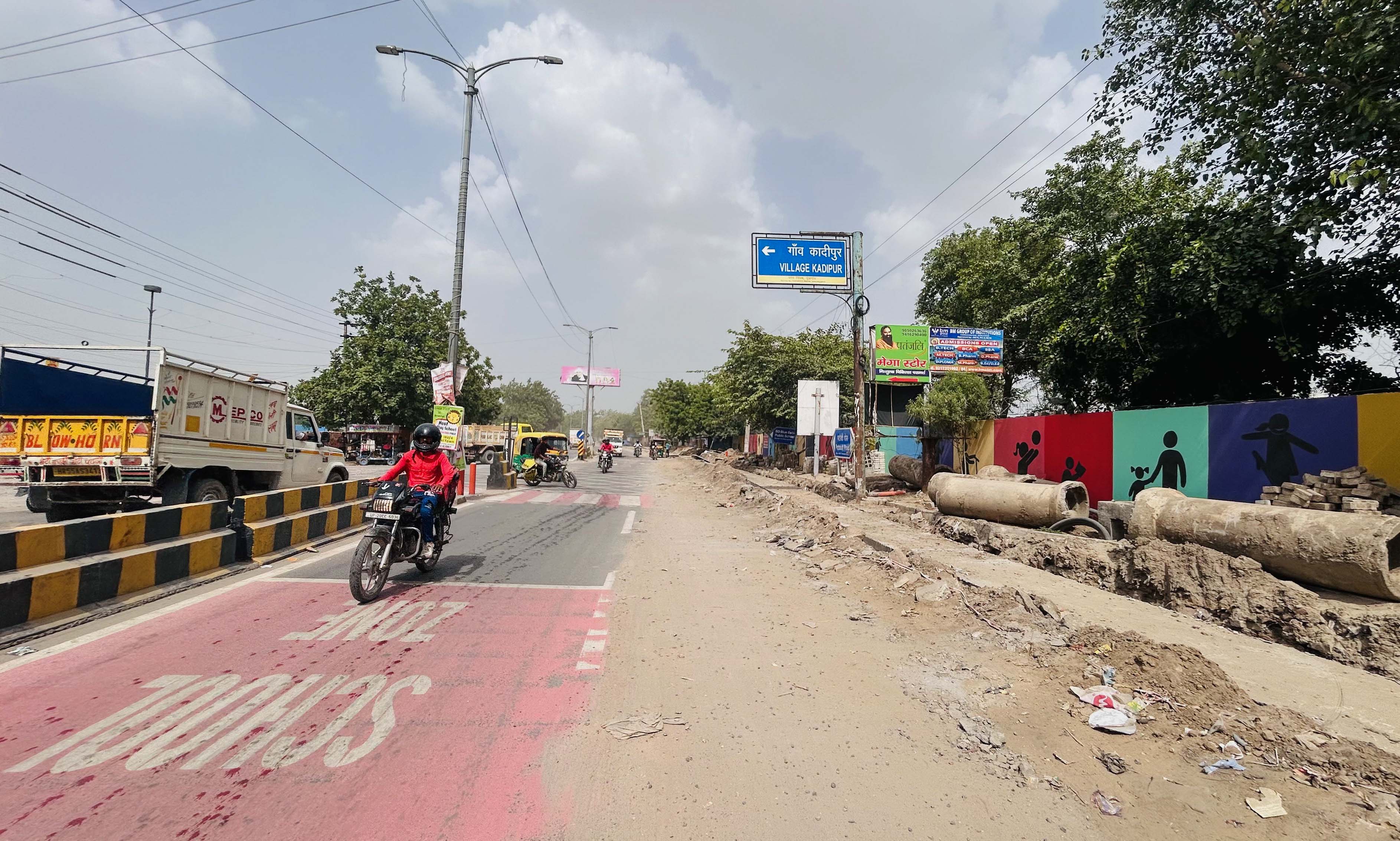 Residents and teachers say faded markings, damaged footpaths and open patches have reduced the effectiveness of traffic calming measures. (Parveen Kumar/HT)