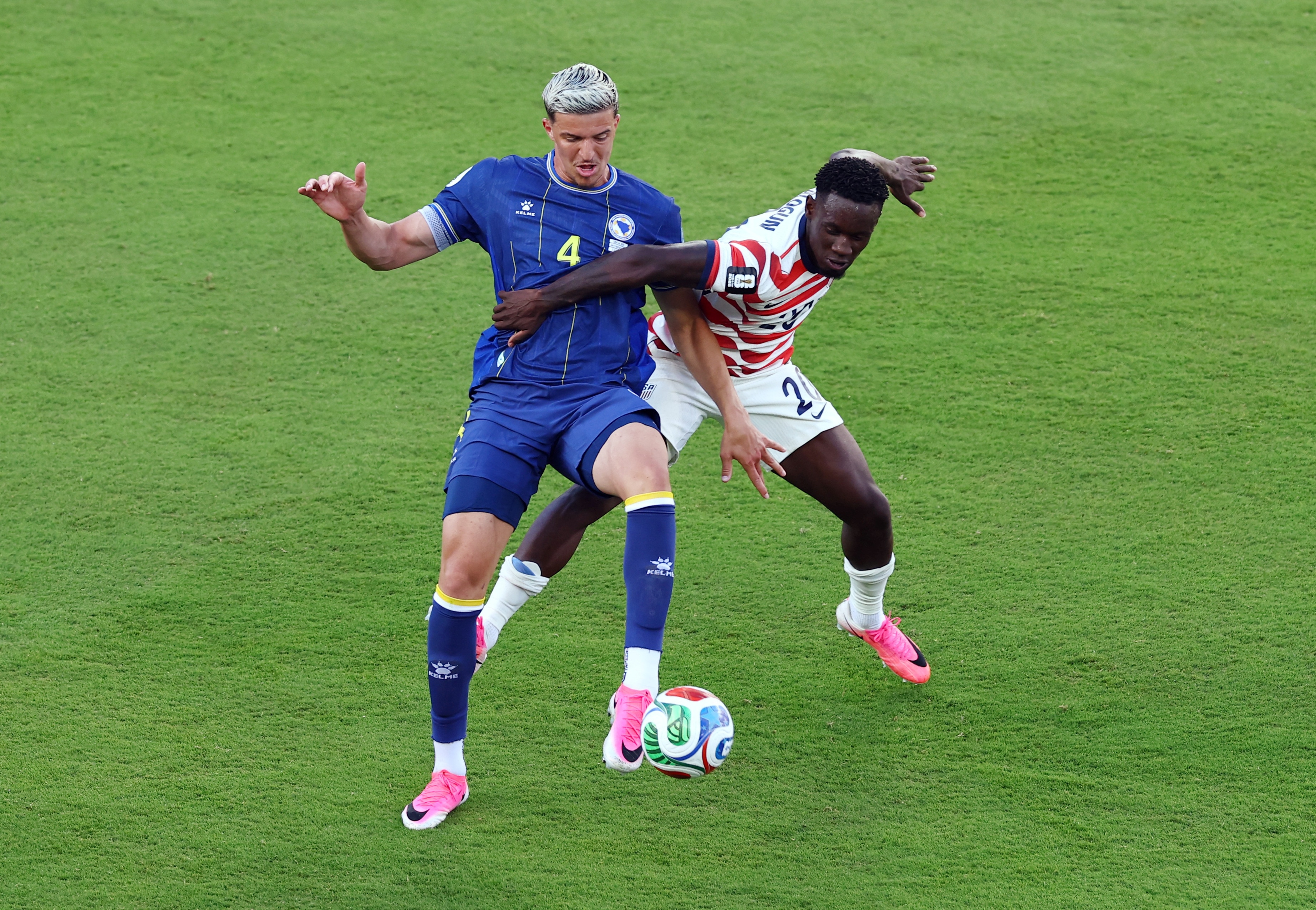 Folarin Balogun of the U.S. in action with Bosnia and Herzegovina's Tarik Muharemovic (REUTERS)