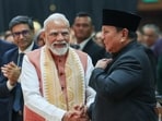 Prime Minister Narendra Modi shakes hands with Indonesian President Prabowo Subianto during an Indian community event in Jakarta on Tuesday. 