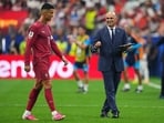 Portugal head coach Roberto Martinez, right, gives instructions to Cristiano Ronaldo (7) during the World Cup round of 16 soccer match between Portugal and Spain in Arlington, Texas