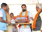 Bihar chief minister Samrat Choudhary being honoured during Sahyog Shivir at Forbesganj in Araria on Tuesday. (HT)