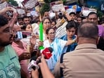 Former West Bengal chief minister and TMC supremo Mamata Banerjee with supporters stages a candle march to protest the alleged rape and murder of an 11-year-old girl at Baruipur, in Kolkata. (@AITCofficial)