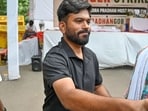 Abhijeet Dipke, founder of the Cockroach Janta Party (CJP), interacts with supporters during a hunger strike in Delhi.