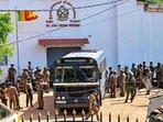 Security personnel escort prisoners to a bus at Negombo prison on the outskirts of Colombo on July 6, 2026, following overnight clashes between inmates of two drug gangs. Security personnel escort prisoners to a bus at Negombo prison on the outskirts of Colombo on July 6, 2026, following overnight clashes between inmates of two drug gangs.