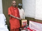 Swami Govind Dev Giri, treasurer, displays ornaments at the Ram Janmabhoomi complex in Ayodhya. (ANI PHOTO)
