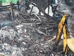 Throughout Monday, civic workers continued clearing the debris at the site amid heavy police deployment and barricades (Raju Shinde)