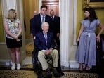 Scott Jennings, a Mitch McConnell adviser, reports the senator is recovering in the hospital. While Republicans expect his return, critics and conspiracy theories raise doubts, with implications for future Senate leadership and upcoming elections.
