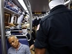 WASHINGTON, DC - JULY 04: Roswell Encina looks on as members of the white supremacist group Patriot Front ride the Washington Metro during Fourth of July celebrations on July 04, 2026 in Washington, DC.  (Photo by Finn Gomez / GETTY IMAGES NORTH AMERICA / Getty Images via AFP)