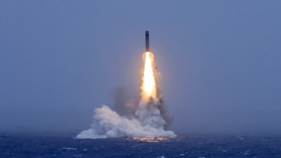 In this photo released by Xinhua News Agency, a long-range ballistic missile bursts out of the sea during a test launched from a Chinese nuclear-powered submarines in the South Pacific on Monday, July 6, 2026. (AP)
