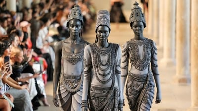 Models transformed into living stone sculptures walked the runway in intricately embroidered ensembles inspired by centuries-old Devi idols and temple carvings. (AFP)