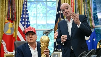 US President Donald Trump joined by FIFA president Gianni Infantino (R) holds the World Cup Trophy as he makes an announcement in the Oval Office of the White House in Washington, DC, on August 22, 2025 (AFP) US President Donald Trump joined by FIFA president Gianni Infantino (R) holds the World Cup Trophy as he makes an announcement in the Oval Office of the White House in Washington, DC, on August 22, 2025 (AFP)